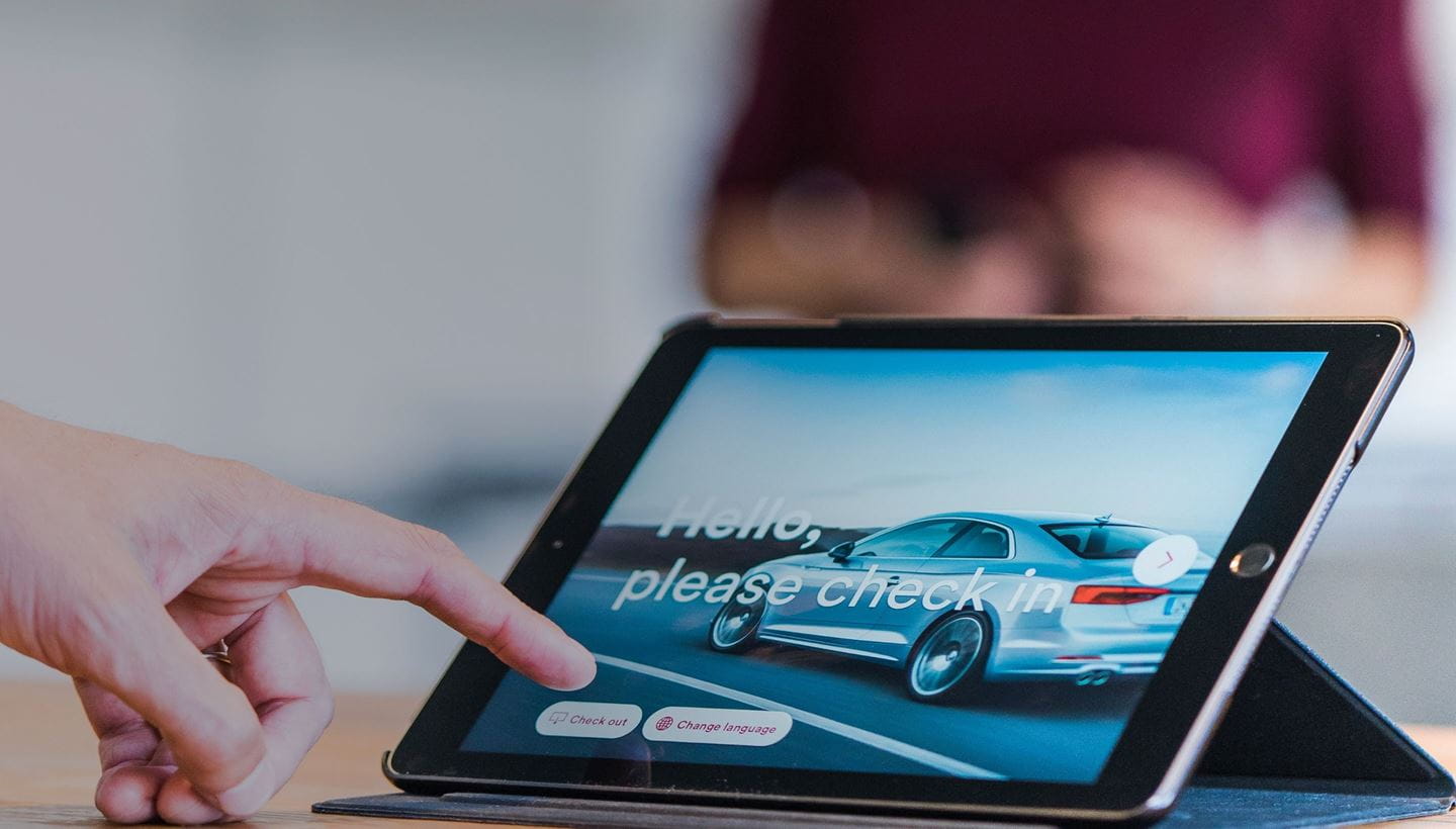 Hand reaching out to a touch screen