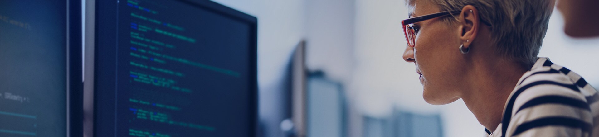 Side view of a woman working on a pc