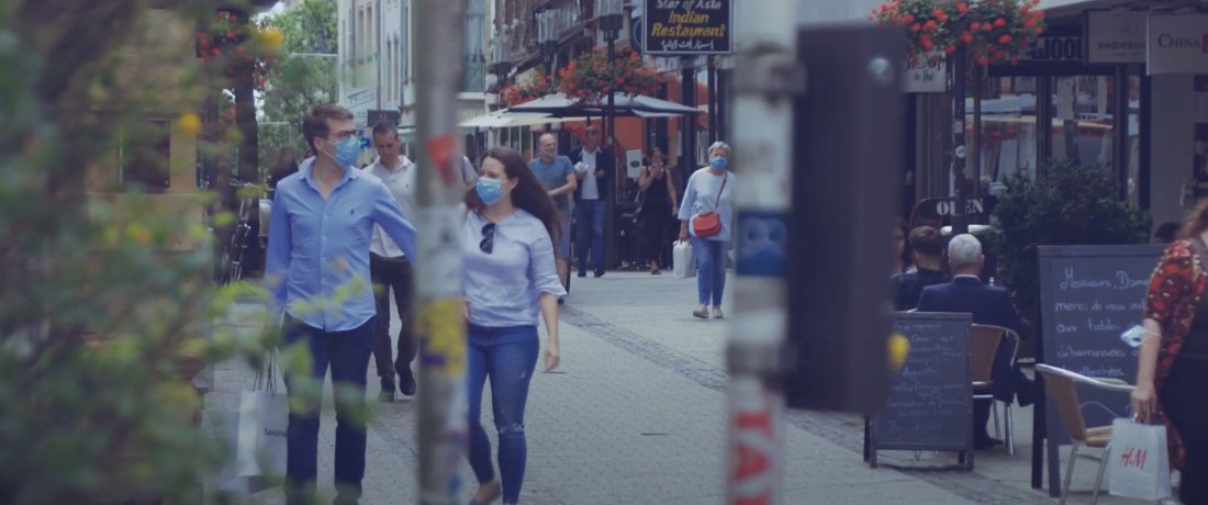 A woman walking through a city center streets