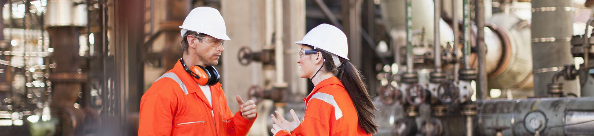 Two construction workers in factory