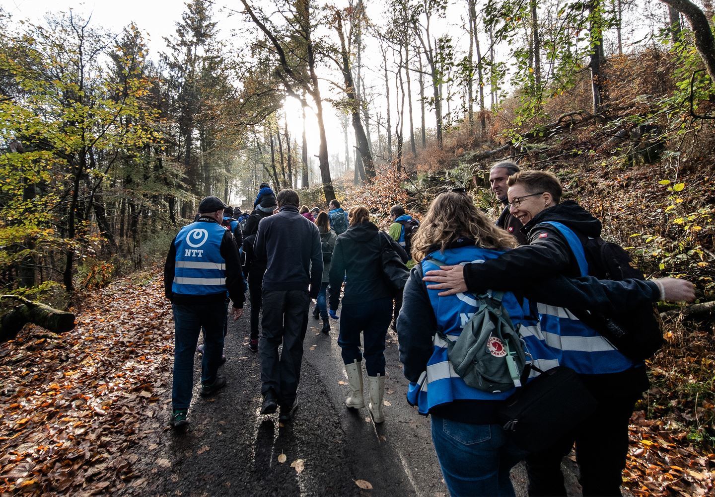 NTT colleagues walking up the hiking trail