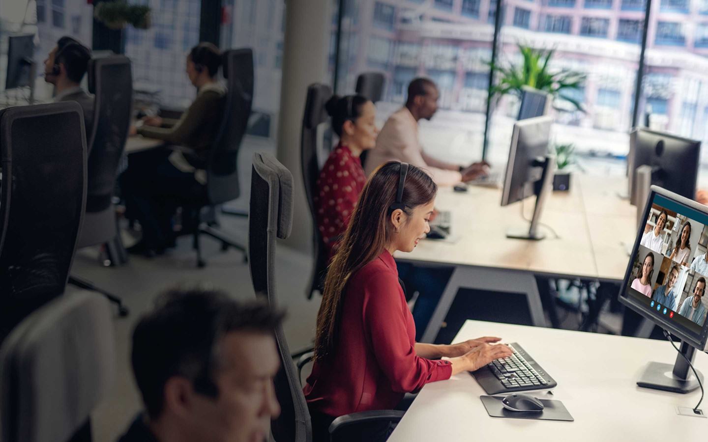 A female worker typing on a PC