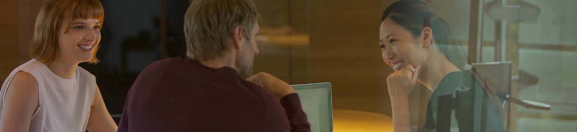 People meeting around a table in an office environment
