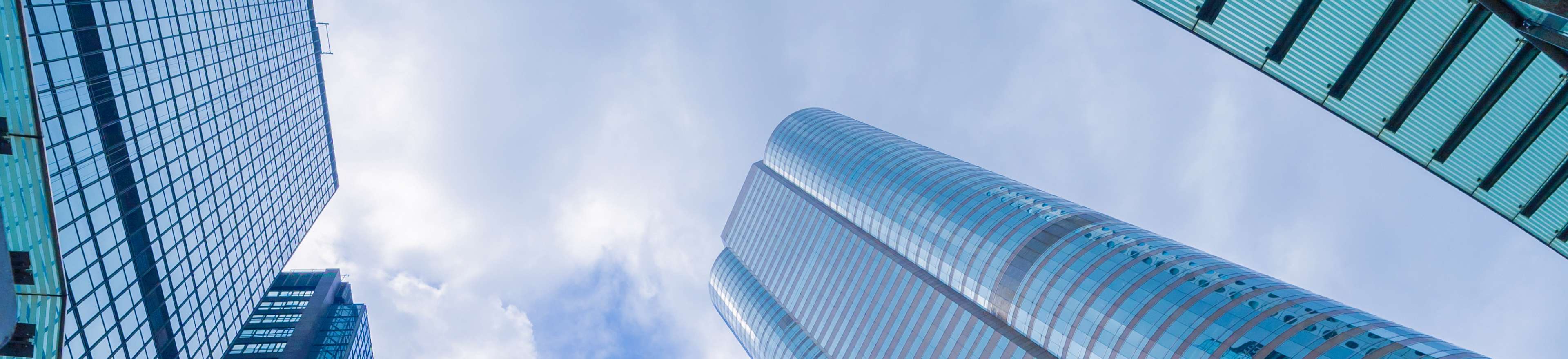 Tall glass buildings next to each other