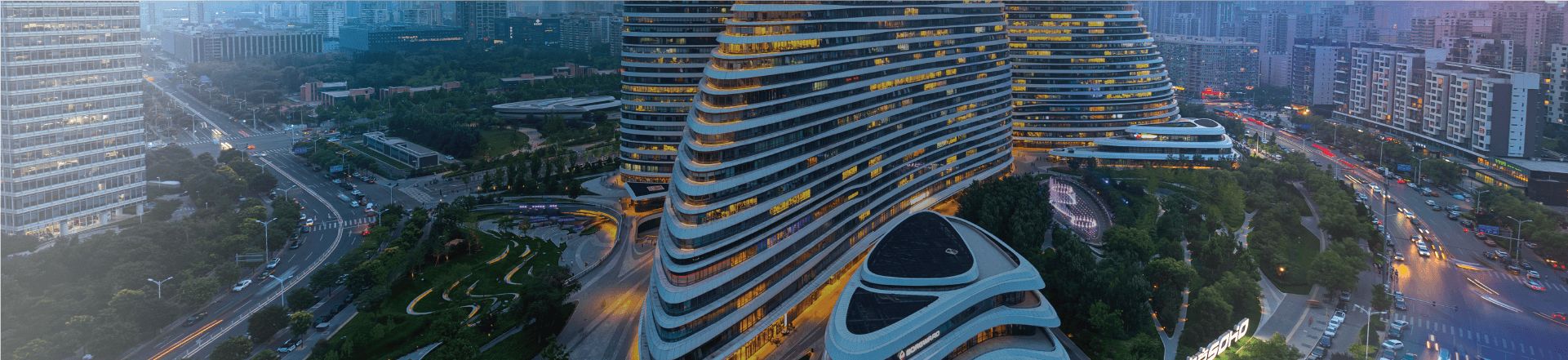 A view of a city and buildings at twilight