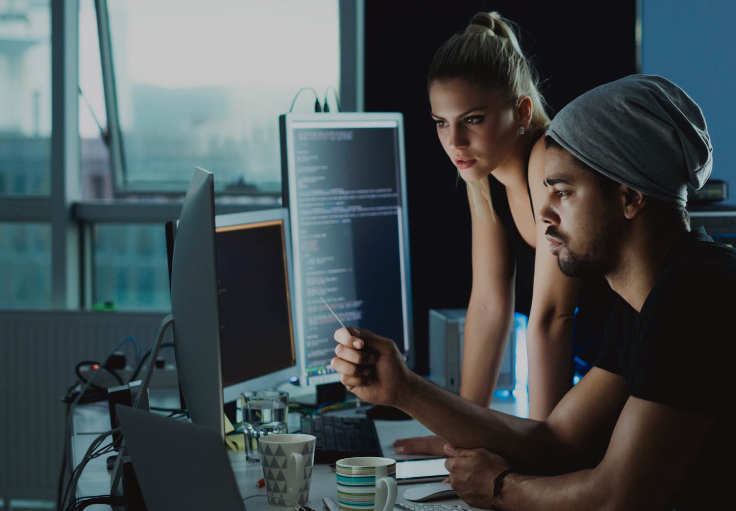 Colleagues looking at monitor