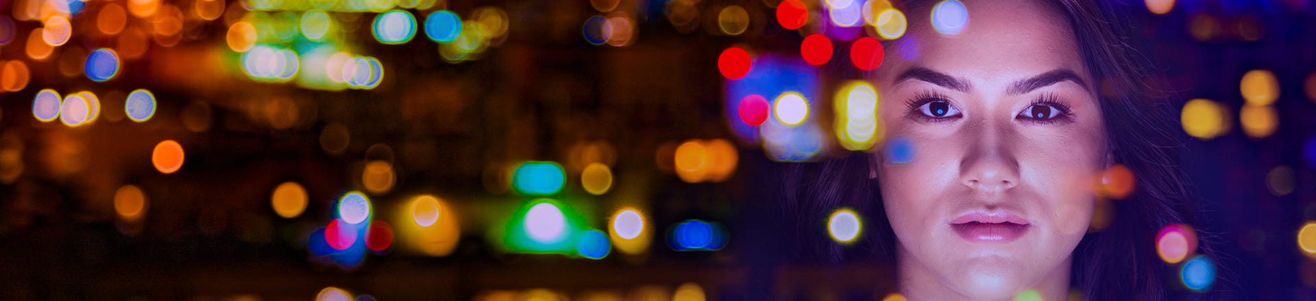 Lady looking at a colorful screen