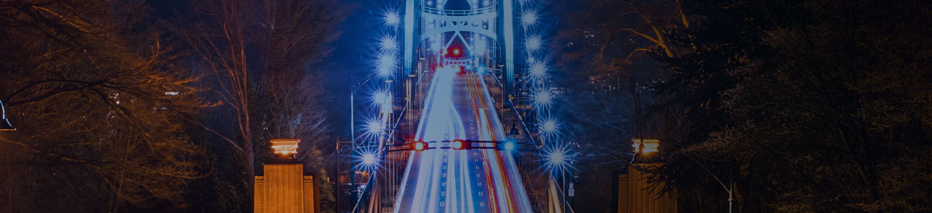 Brightly lit road with light trails at night