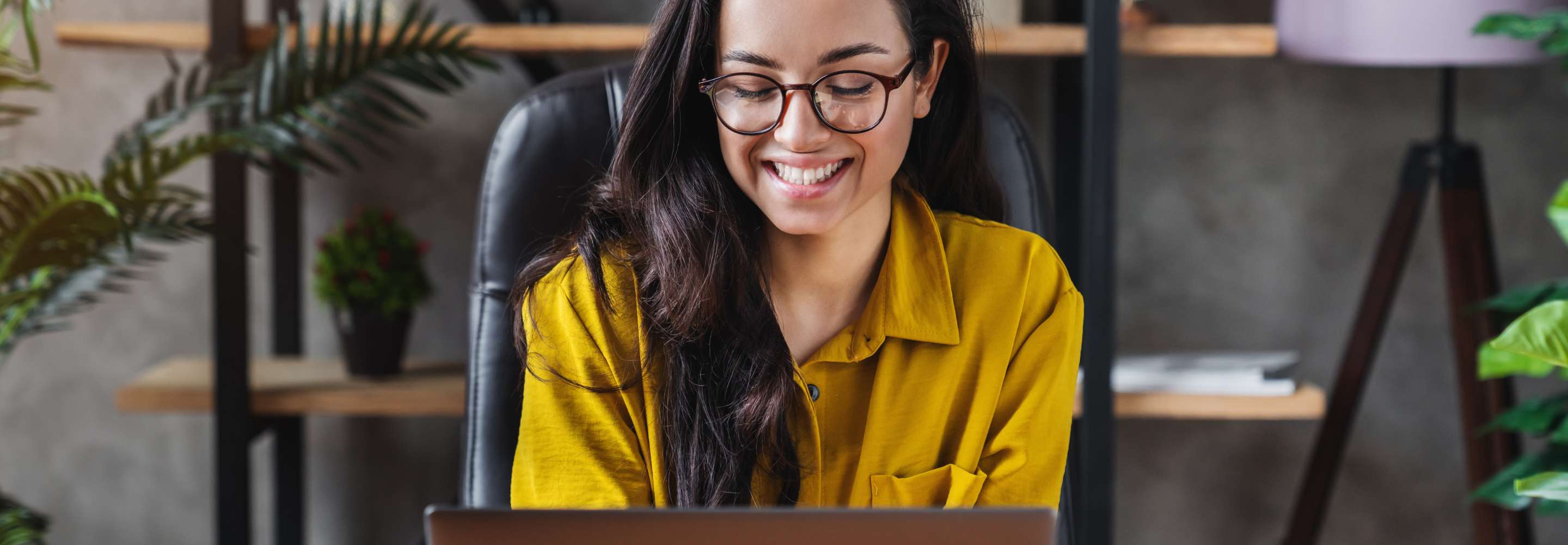 A man in a yellow shirt smiling