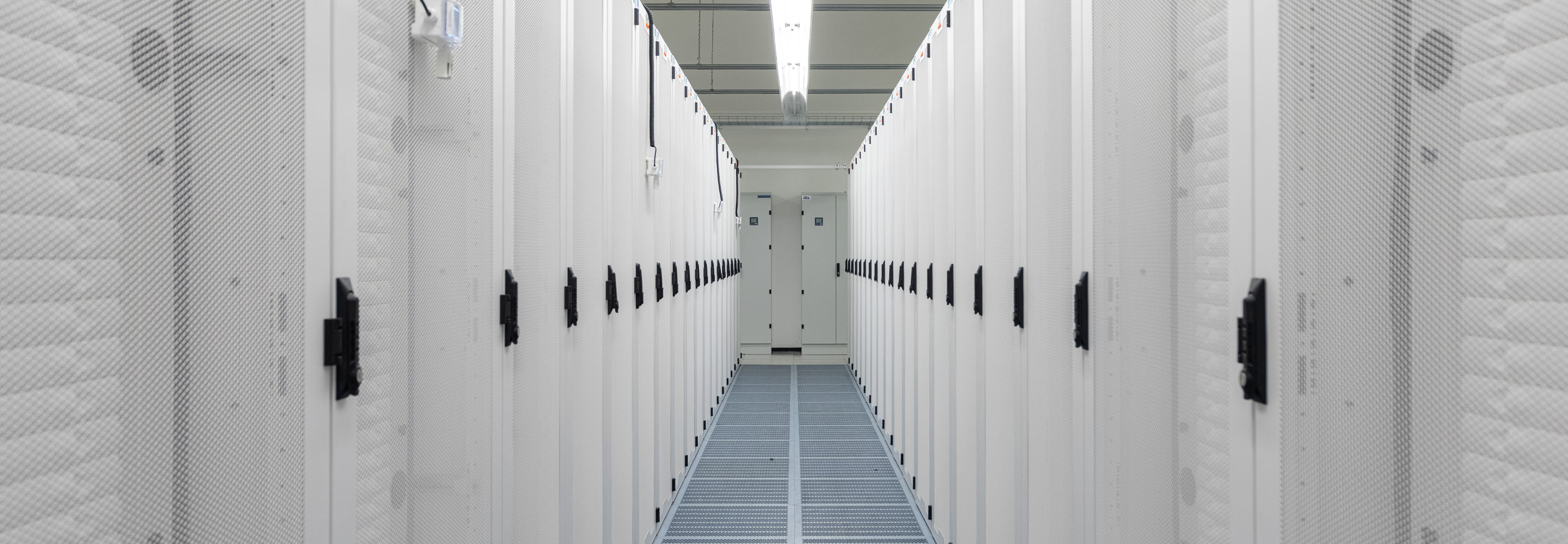 A narrow passage with white walls on both sides