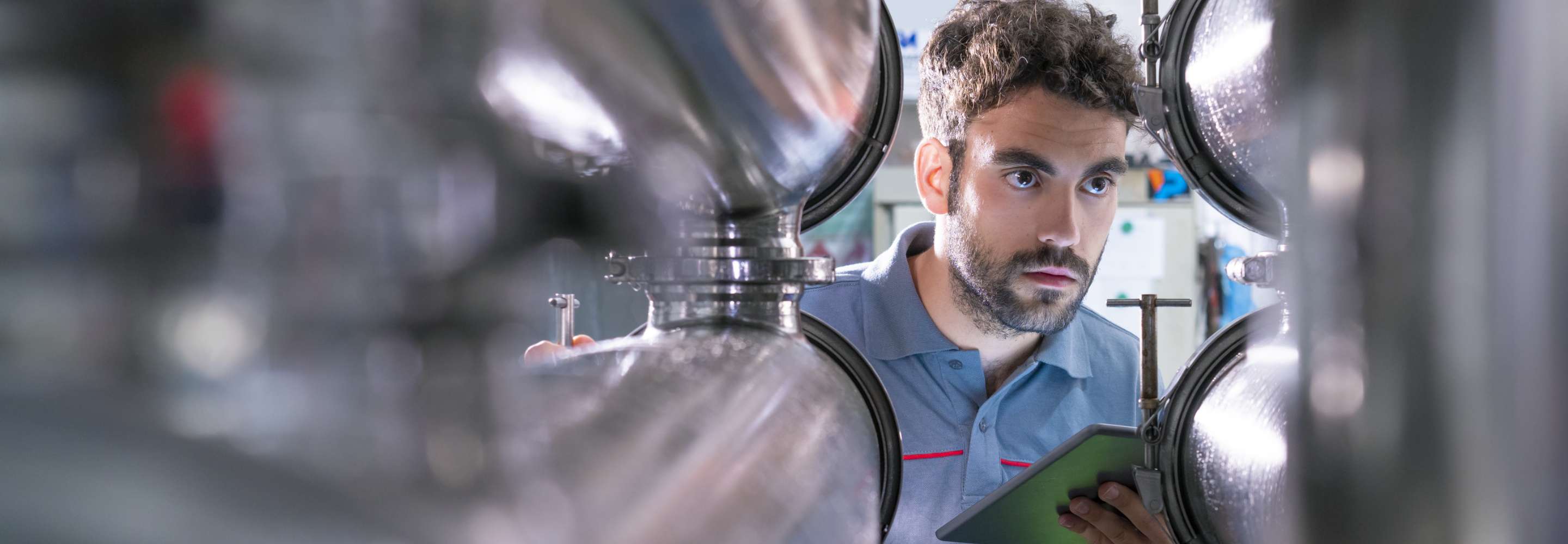 A front view of a man in between objects